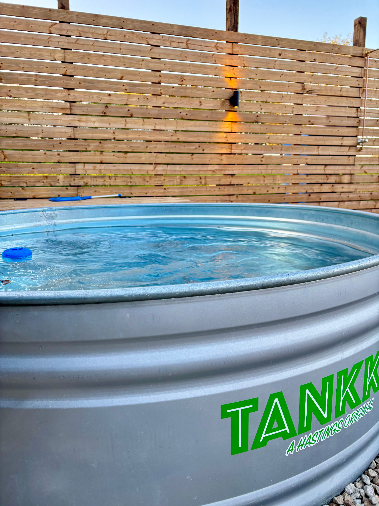 Galvanised cold plunge tub filled with cold water